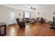 Comfortable living room with hardwood floors, sofas, and a large front window at 1723 Needle Palm Dr, Edgewater, FL 32132