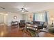 Inviting living room with hardwood floors, plush sofas, and natural light at 1723 Needle Palm Dr, Edgewater, FL 32132