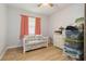 Bedroom featuring a floral sofa and white dresser at 1920 Travelers Palm Dr, Edgewater, FL 32141
