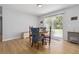 Cozy dining area has a sliding door to the backyard and laminate floors at 1920 Travelers Palm Dr, Edgewater, FL 32141