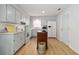 Charming kitchen with a movable island, updated appliances, and ample cabinet space at 1920 Travelers Palm Dr, Edgewater, FL 32141