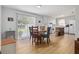 Eat-in kitchen with backyard access through sliding doors and featuring white appliances at 1920 Travelers Palm Dr, Edgewater, FL 32141