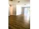 Spacious, bright room with vinyl floors and sliding glass door to the backyard; ready for your personal touch at 1920 Travelers Palm Dr, Edgewater, FL 32141