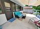 Spacious patio with a cushioned sofa, side table and outdoor seating, perfect for entertaining guests at 1941 Spruce Creek Lndg, Port Orange, FL 32128