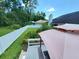 The deck and patio in backyard overlooking the well-maintained fenced yard provides a private retreat at 1941 Spruce Creek Lndg, Port Orange, FL 32128
