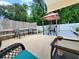 Fenced-in backyard boasts a gazebo with outdoor furniture set on a well-maintained wooden deck at 1941 Spruce Creek Lndg, Port Orange, FL 32128