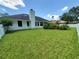Expansive backyard featuring a well-maintained lawn, offering plenty of space for outdoor activities and relaxation at 1941 Spruce Creek Lndg, Port Orange, FL 32128