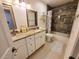 Bathroom features dual sinks with granite countertops, custom tiled shower, and modern vanity at 1941 Spruce Creek Lndg, Port Orange, FL 32128