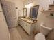 Bathroom featuring a double sink vanity with granite countertops and a toilet at 1941 Spruce Creek Lndg, Port Orange, FL 32128