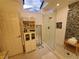Bright bathroom with a glass shower, mosaic tile, skylight and modern fixtures at 1941 Spruce Creek Lndg, Port Orange, FL 32128