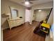 Bedroom with modern light fixture, dresser, and mirrored closet at 1941 Spruce Creek Lndg, Port Orange, FL 32128