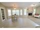 Dining area with fireplace, bay window, and stylish table with chairs at 1941 Spruce Creek Lndg, Port Orange, FL 32128