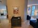 Welcoming entryway with coastal decor and furniture, leading into a bright living space at 1941 Spruce Creek Lndg, Port Orange, FL 32128