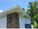 A well-kept house exterior showcases brick accents, with the garage and an external light fixture at 1941 Spruce Creek Lndg, Port Orange, FL 32128