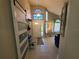 Bright, airy foyer features high ceilings, large windows, and a modern sliding door at 1941 Spruce Creek Lndg, Port Orange, FL 32128