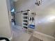 Entryway with a sliding barn door, light floors, and a place to hang your coat at 1941 Spruce Creek Lndg, Port Orange, FL 32128