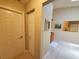 Hallway featuring wood floors and decorative touches near an additional kitchenette at 1941 Spruce Creek Lndg, Port Orange, FL 32128
