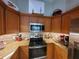 Kitchen with stainless steel appliances and granite countertops at 1941 Spruce Creek Lndg, Port Orange, FL 32128