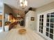 Kitchen features a vaulted ceiling, modern appliances, wooden cabinets and granite countertops, creating a functional and stylish space at 1941 Spruce Creek Lndg, Port Orange, FL 32128