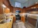 Updated kitchen with stainless steel appliances, granite countertops and tile backsplash at 1941 Spruce Creek Lndg, Port Orange, FL 32128