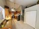 Open kitchen with stainless steel appliances, granite countertops, and ample cabinet space at 1941 Spruce Creek Lndg, Port Orange, FL 32128