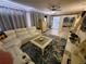 Cozy living room with a sectional sofa, stylish rug, and open layout at 1941 Spruce Creek Lndg, Port Orange, FL 32128