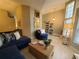 Bright living room with modern furnishings and sliding barn door at 1941 Spruce Creek Lndg, Port Orange, FL 32128