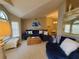 Open-concept living and dining area with modern furnishings and large windows at 1941 Spruce Creek Lndg, Port Orange, FL 32128