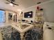 Open living area featuring a sectional sofa, stylish rug, and built-in shelves at 1941 Spruce Creek Lndg, Port Orange, FL 32128