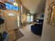 Inviting living room with natural light, high ceilings, and comfortable blue furniture at 1941 Spruce Creek Lndg, Port Orange, FL 32128