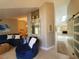 Open-concept living room flows into dining area, with modern furnishings at 1941 Spruce Creek Lndg, Port Orange, FL 32128