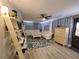 Comfortable living room with a sectional sofa, ceiling fan, and cozy decor at 1941 Spruce Creek Lndg, Port Orange, FL 32128