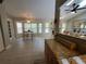 Open-concept floor plan connecting the kitchen with the living room and fireplace at 1941 Spruce Creek Lndg, Port Orange, FL 32128