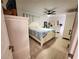 Inviting main bedroom features hardwood floors and white furnishings at 1941 Spruce Creek Lndg, Port Orange, FL 32128