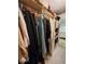 Well-organized walk-in closet provides ample storage space for clothing at 1941 Spruce Creek Lndg, Port Orange, FL 32128