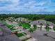 Residential street featuring townhomes and mature shade trees at 1983 Turnbull Lakes Dr, New Smyrna Beach, FL 32168