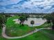 Scenic golf course community with lush greenery and beautiful lake views at 1983 Turnbull Lakes Dr, New Smyrna Beach, FL 32168