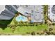 Overhead view of the pool, parking area, and surrounding green spaces at 2 Oceans West Blvd # 702, Daytona Beach, FL 32118