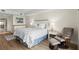 A spacious bedroom with a sitting area is brightly lit from natural light at 2 Oceans West Blvd # 702, Daytona Beach, FL 32118