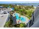 Aerial shot showcasing a uniquely shaped pool and deck perfect for relaxation in a tropical setting at 2 Oceans West Blvd # 702, Daytona Beach, FL 32118
