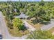 This charming home has mature shade trees and a long driveway at 200 W Washington Ave, Deland, FL 32720