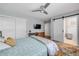 Bedroom featuring a sliding barn door leading to a bathroom at 200 W Washington Ave, Deland, FL 32720