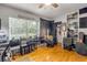 Bedroom with hardwood floors, natural light, and built-in shelving at 200 W Washington Ave, Deland, FL 32720