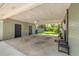 Spacious carport with secure storage rooms, perfect for parking and outdoor storage at 200 W Washington Ave, Deland, FL 32720