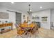 Dining room featuring an octagonal table, chandelier, and sliding barn door at 200 W Washington Ave, Deland, FL 32720