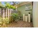 Exterior corner of the home with a well and filtration system at 200 W Washington Ave, Deland, FL 32720