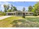 Charming single-story home with a well-maintained lawn and a cozy ambiance at 200 W Washington Ave, Deland, FL 32720