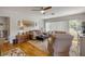Inviting living room featuring a ceiling fan, hardwood floors, and comfortable sofas at 200 W Washington Ave, Deland, FL 32720