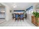 Dining room area featuring tile floors, natural light, and a ceiling fan at 210 Delespine Dr, Debary, FL 32713