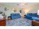 Relaxing living room featuring comfortable sofas, a ceiling fan, and decor at 210 Delespine Dr, Debary, FL 32713